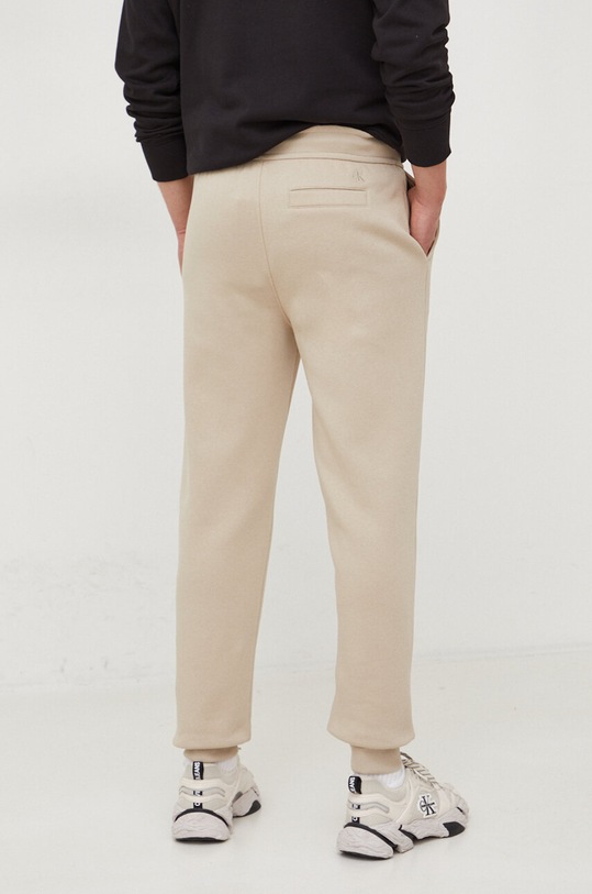 Odzież Calvin Klein Jeans spodnie dresowe J30J324685 beżowy