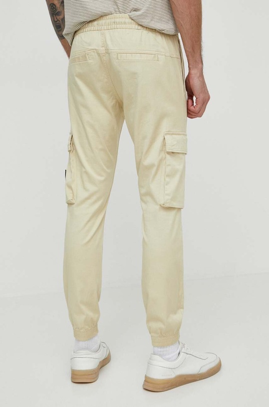 Odzież Calvin Klein Jeans spodnie J30J324696 beżowy