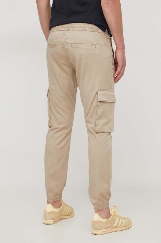 Odzież Calvin Klein Jeans spodnie J30J324696 beżowy