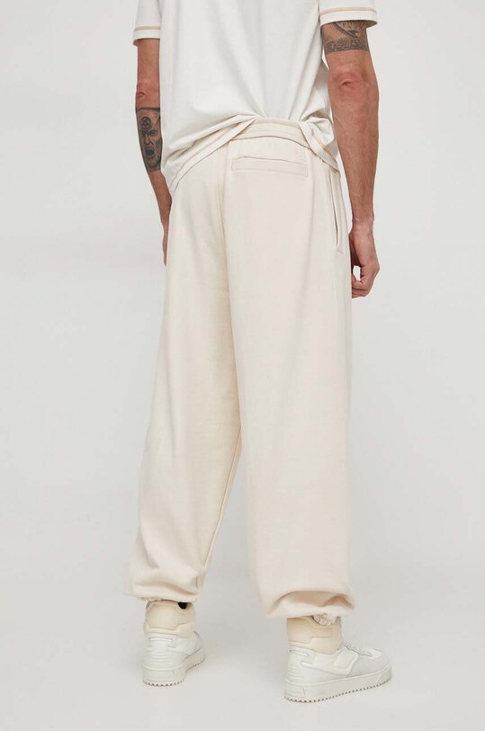 Îmbrăcăminte Calvin Klein Jeans pantaloni de trening din bumbac J30J324953 bej