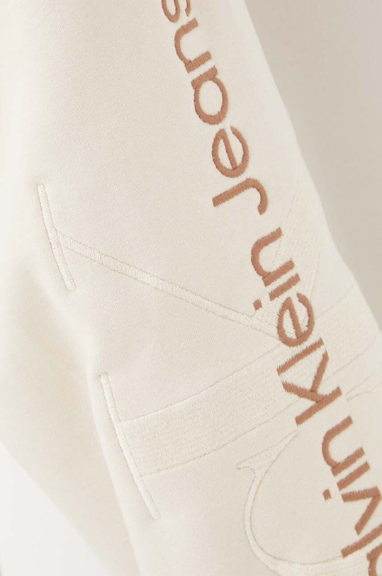 Bavlněné tepláky Calvin Klein Jeans J30J324953 béžová