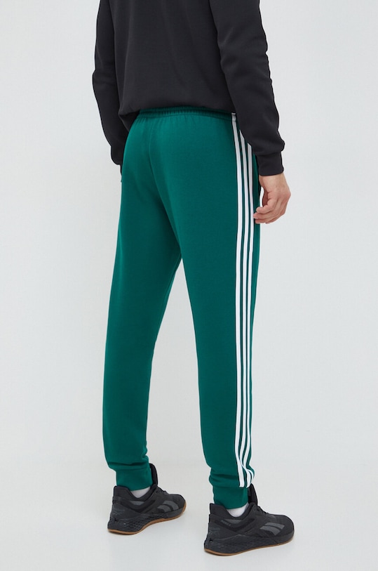 Odzież adidas spodnie dresowe Essentials IN0342 zielony