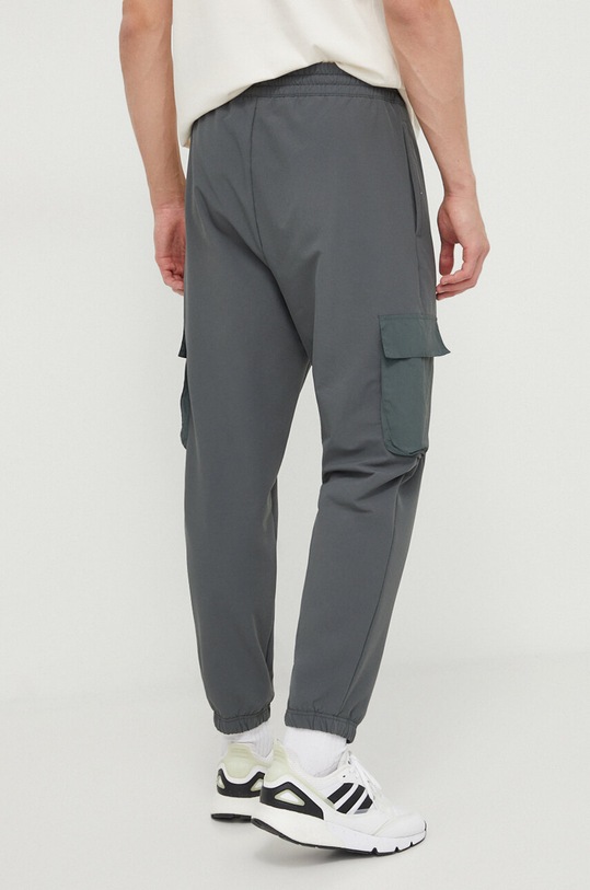 Îmbrăcăminte adidas pantaloni de trening IN3699 verde