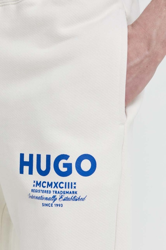 Bavlněné tepláky Hugo Blue béžová 50510734