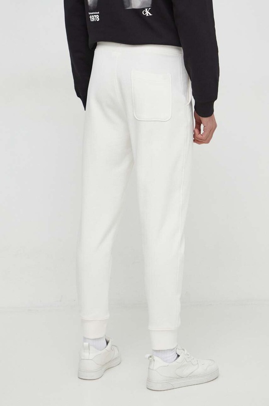 Odzież United Colors of Benetton spodnie dresowe bawełniane 3J68UF00K beżowy