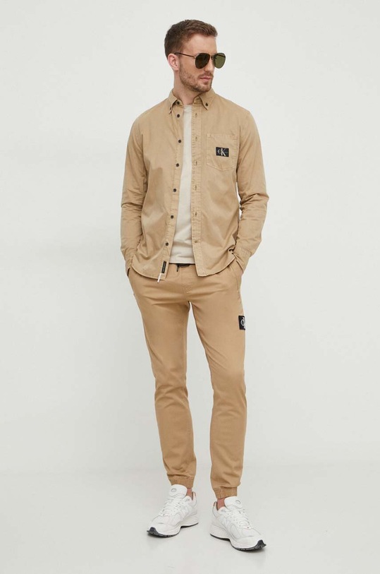 Nohavice Calvin Klein Jeans J30J325114 béžová SS24