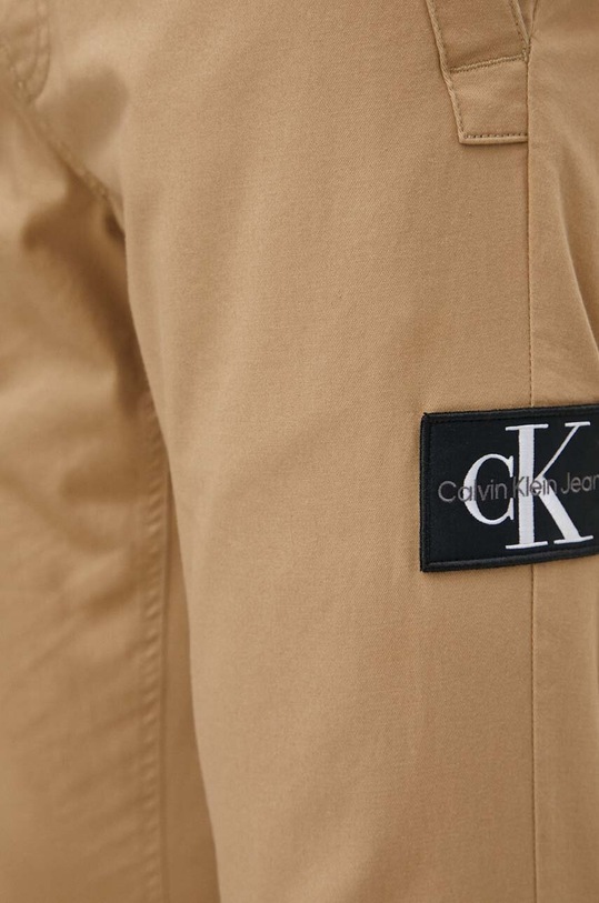 Nohavice Calvin Klein Jeans béžová J30J325114