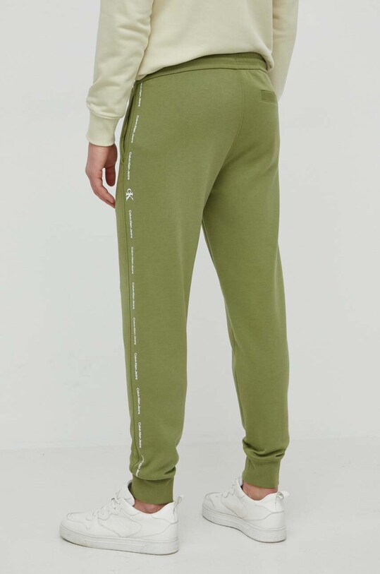 Одежда Спортивные штаны Calvin Klein Jeans J30J325494 зелёный