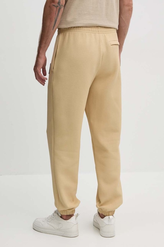 Îmbrăcăminte Lacoste pantaloni de trening XH7441 bej