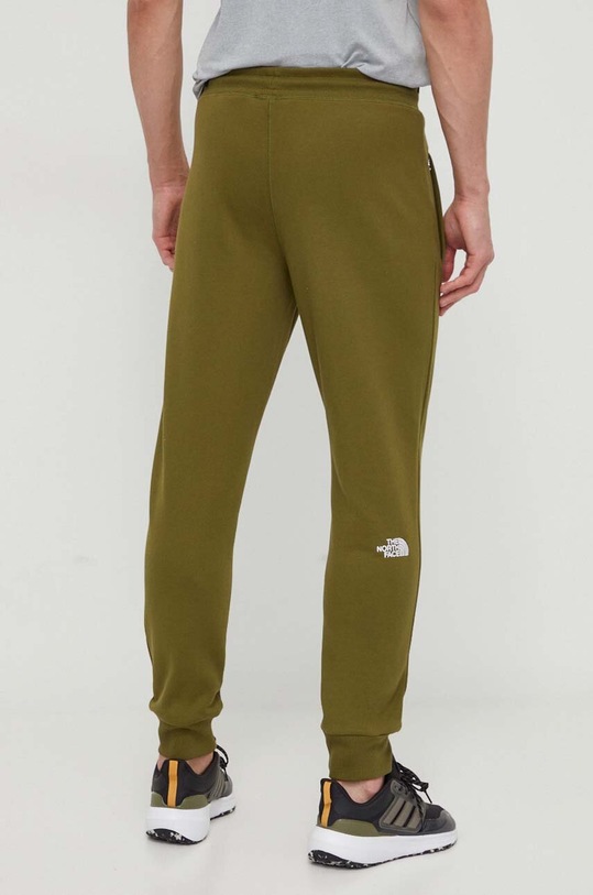 Odzież The North Face spodnie dresowe bawełniane NF0A4SVQPIB1 zielony