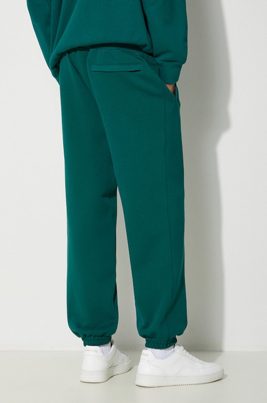 Odjeća Pamučni donji dio trenirke Puma MMQ Sweatpants 624007 tirkizna