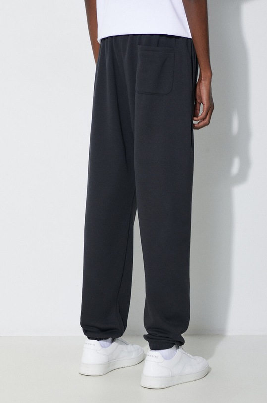 Odzież New Balance spodnie dresowe Essentials French Terry Jogger MP41519BK czarny