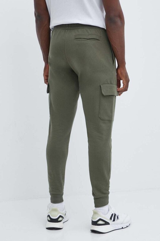 Odzież Under Armour spodnie dresowe 1382134 zielony
