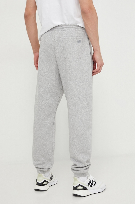 Odzież New Balance spodnie dresowe MP41505AG MP41505AG szary