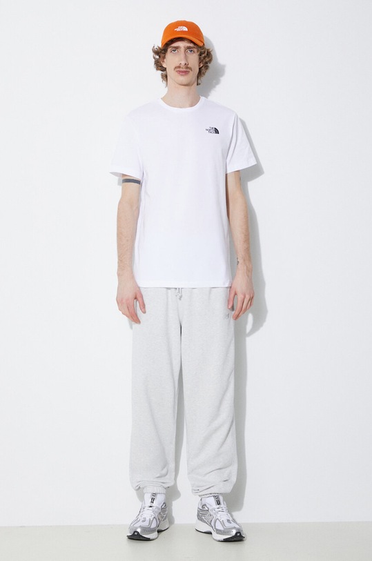 Bavlněné tepláky New Balance MP41508AHH MP41508AHH šedá SS24