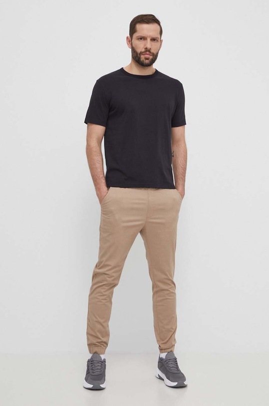 Nohavice Champion 219865 béžová SS24