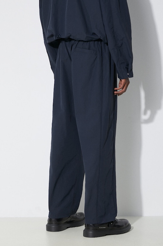 Oblečenie Nohavice AMBUSH Nylon Track Pants BMCJ002S24FAB0014646 tmavomodrá