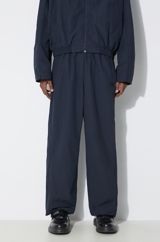 Nohavice AMBUSH Nylon Track Pants tmavomodrá BMCJ002S24FAB0014646