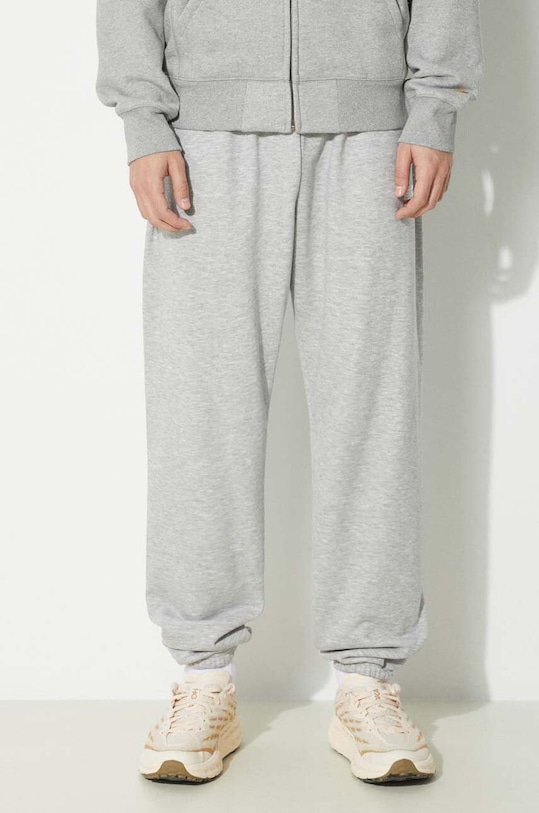 New Balance spodnie dresowe Sport Essentials szary MP41519AG