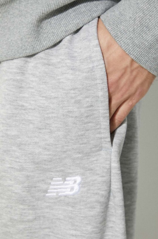 New Balance spodnie dresowe Sport Essentials MP41519AG szary