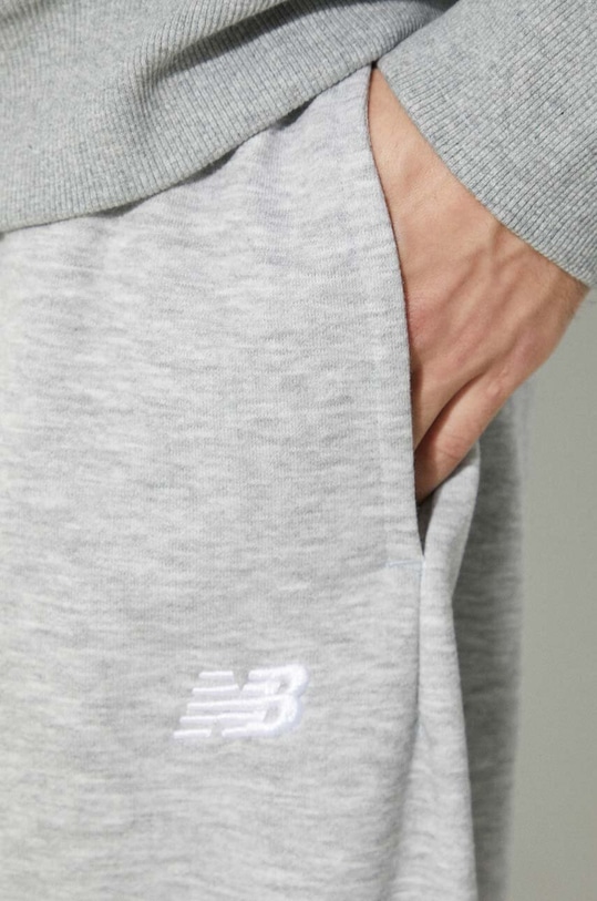 New Balance spodnie dresowe Sport Essentials MP41519AG szary