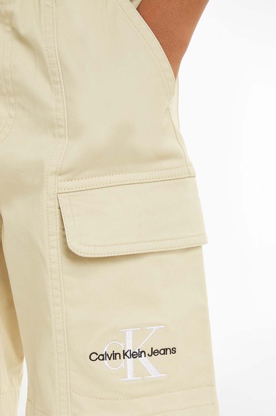 Dětské kraťasy Calvin Klein Jeans IB0IB02057.PPYH žlutá