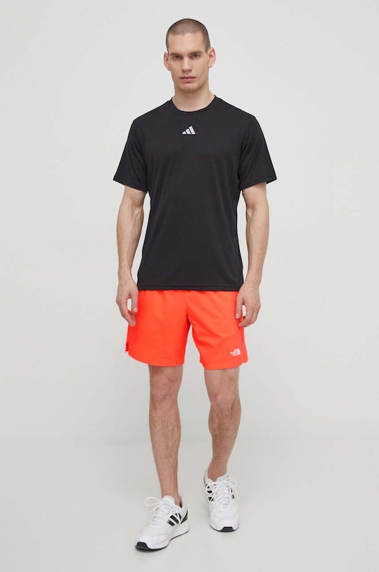 Спортен къс панталон The North Face NF0A3O1BQI41 оранжев SS24