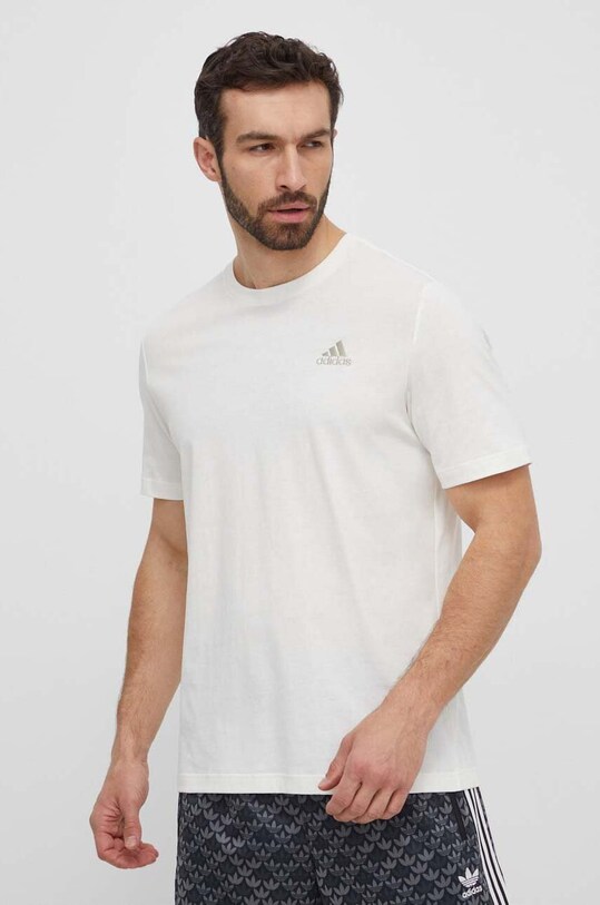 Бавовняна футболка adidas бежевий IS1318