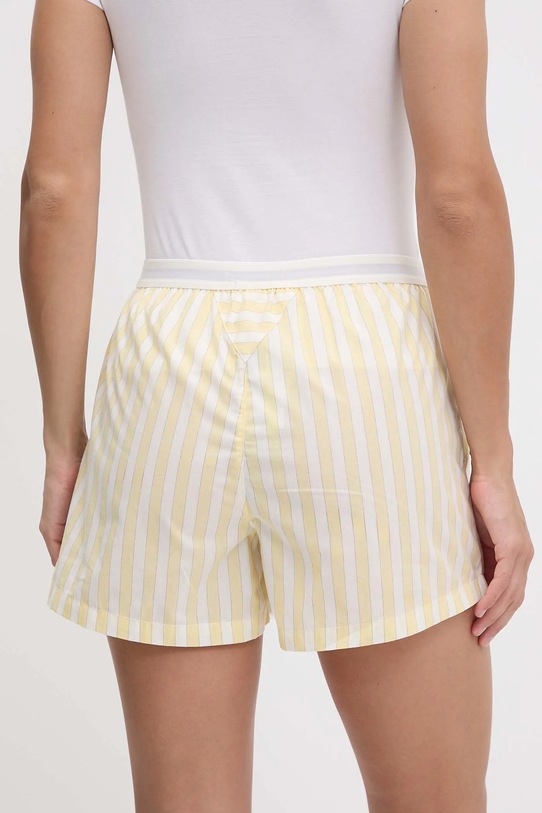 Bavlněné šortky Tommy Hilfiger UW0UW05765 žlutá SS25