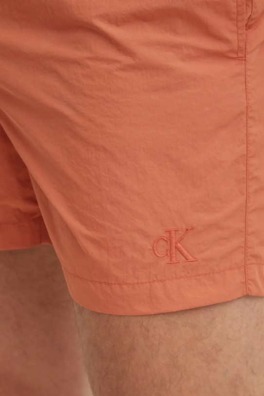 Купальні шорти Calvin Klein помаранчевий KM0KM01080