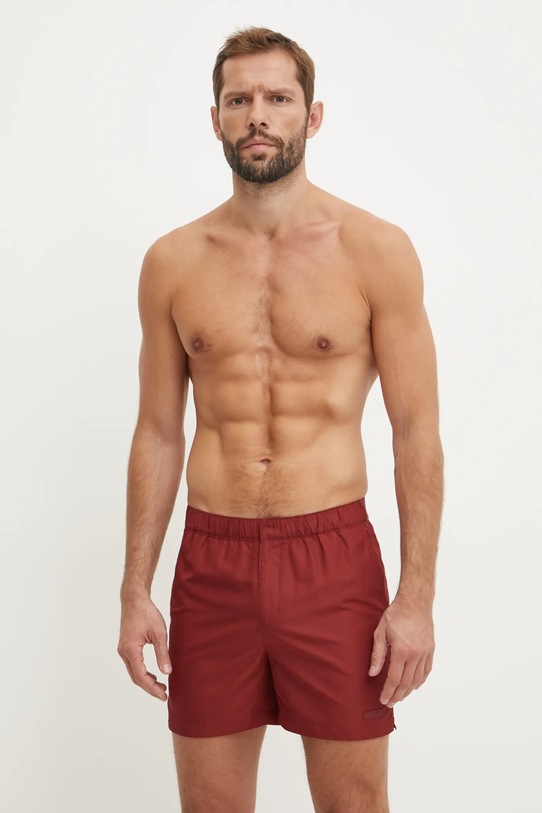 Kratke hlače za kupanje Calvin Klein bez uzorka crvena KM0KM01084