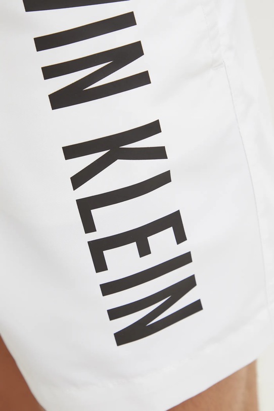 Plavkové šortky Calvin Klein bílá KM0KM01092