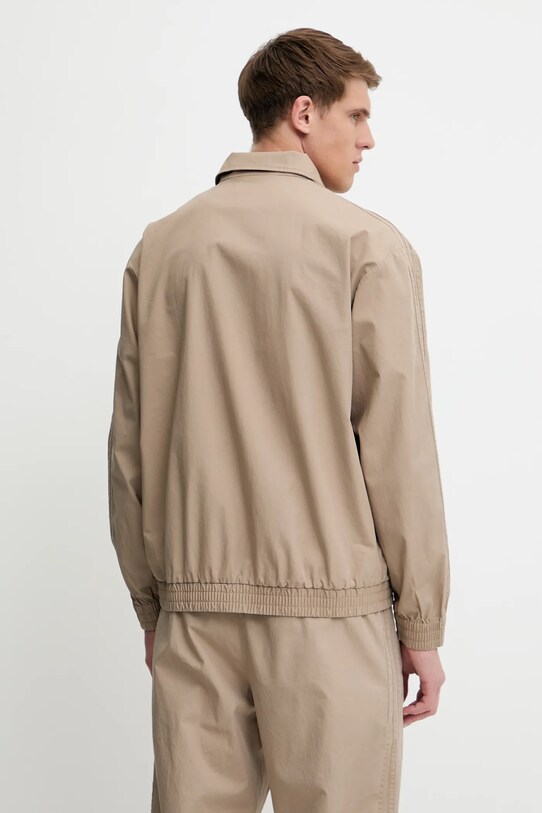 Бавовняна куртка adidas Originals Firebird Jacket бежевий KC0685