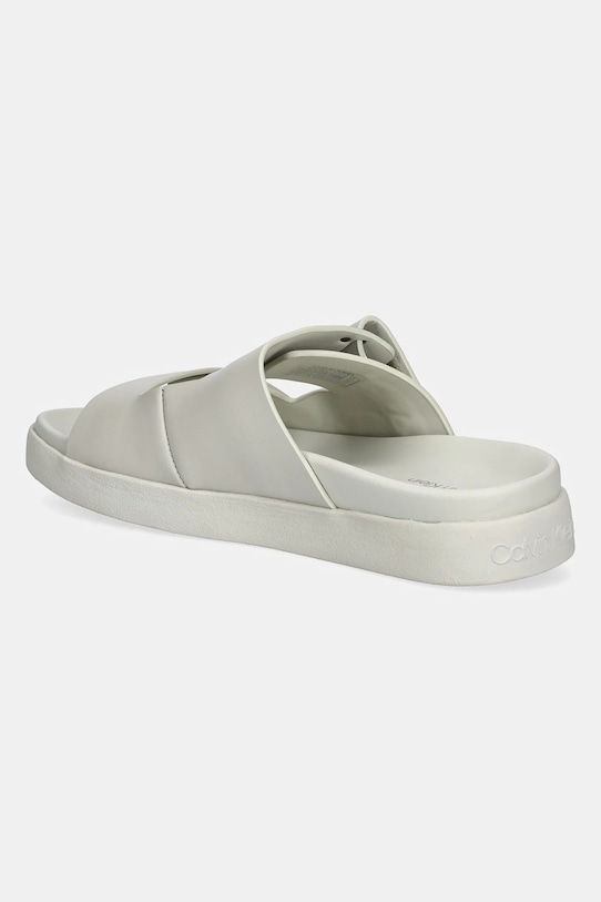 Шкіряні шльопанці Calvin Klein FLAT ADJ SLIDE EYELET HW0HW02489 бежевий SS25