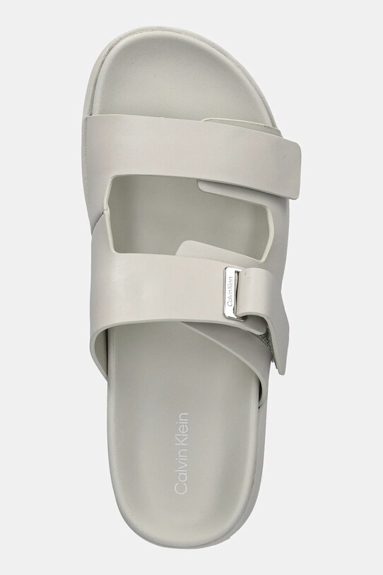 Calvin Klein klapki skórzane FLAT ADJ SLIDE EYELET beżowy HW0HW02489