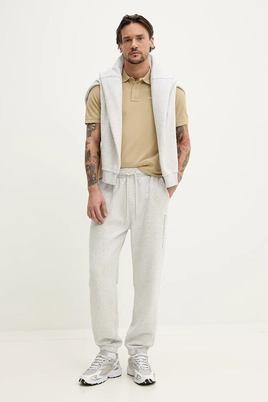 Памучна тениска с яка Tommy Jeans DM0DM20914 бежов SS25