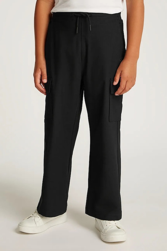 Дитячі спортивні штани Calvin Klein Jeans DRY KNIT SKATER трикотаж чорний IB0IB02344.PPYA