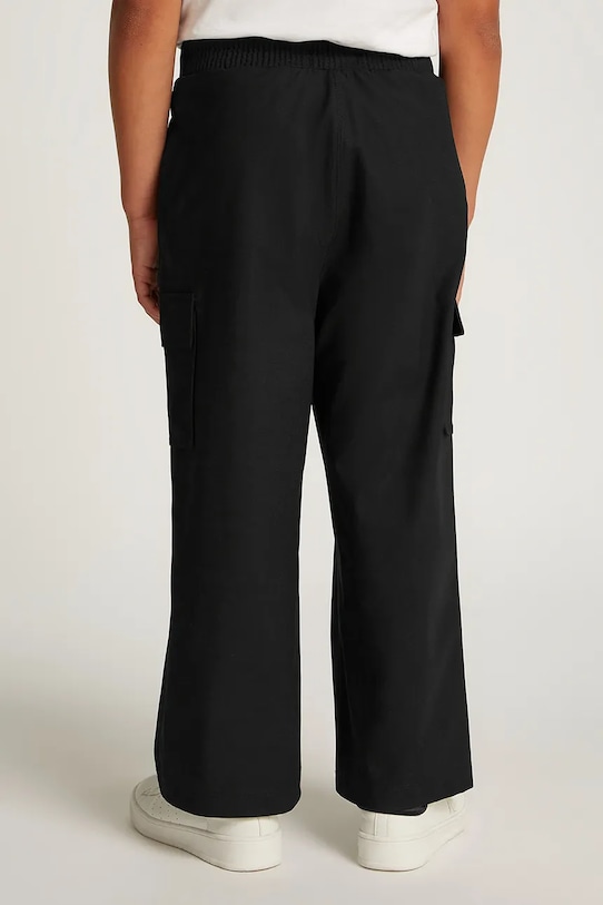 Дитячі спортивні штани Calvin Klein Jeans DRY KNIT SKATER чорний IB0IB02344.PPYA