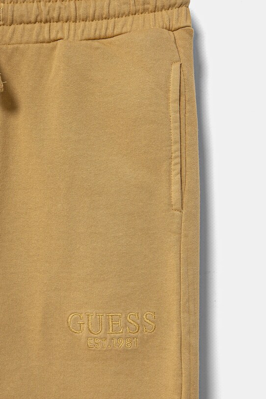 Chłopiec Guess spodnie dresowe bawełniane dziecięce L5RQ14.KAD74.PPYA żółty