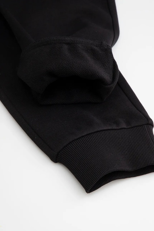 Dječji pamučni donji dio trenirke Coccodrillo crna WC5120101VBA