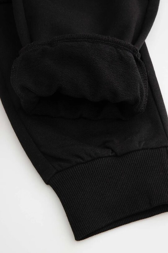 Dječji pamučni donji dio trenirke Coccodrillo crna WC5120104MBJ