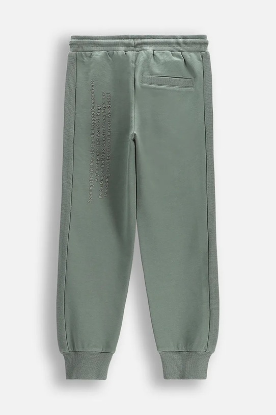 Otroški spodnji del trenirke Coccodrillo WC5120101SBK zelena SS25