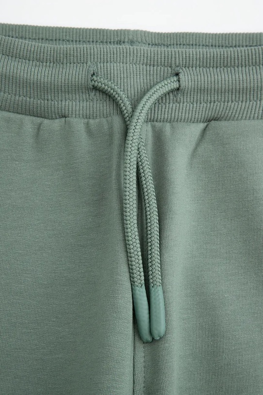 Dečki Otroški spodnji del trenirke Coccodrillo WC5120101SBK zelena