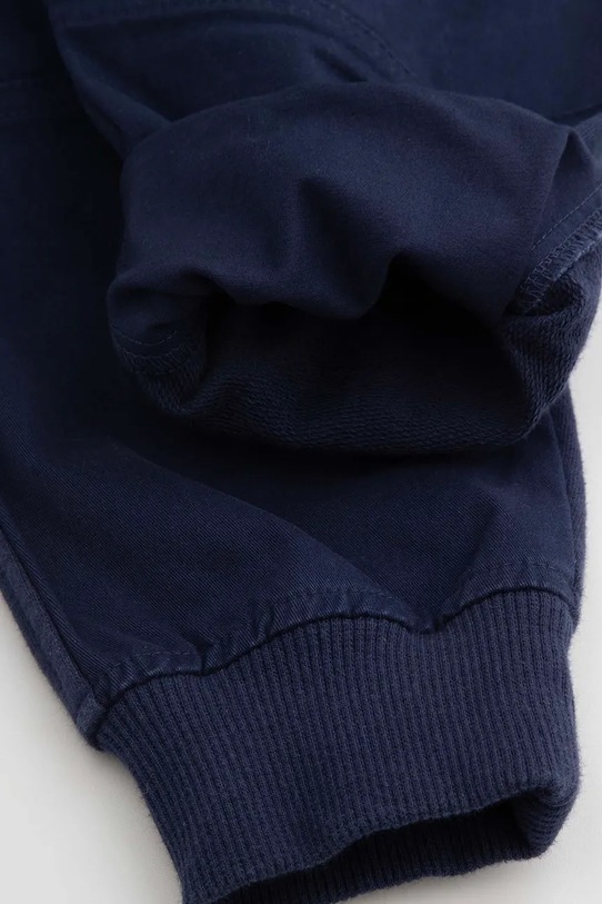 Coccodrillo pantaloni de trening pentru copii bleumarin WC5119101CBK