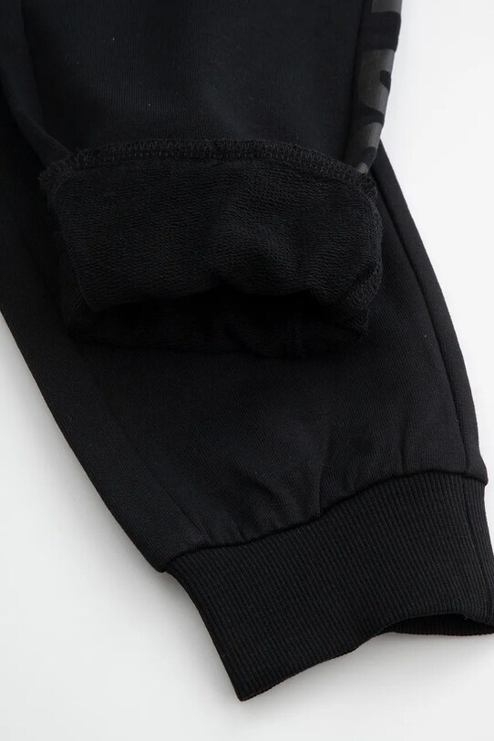 Dječji pamučni donji dio trenirke Coccodrillo WC5120101DBJ crna