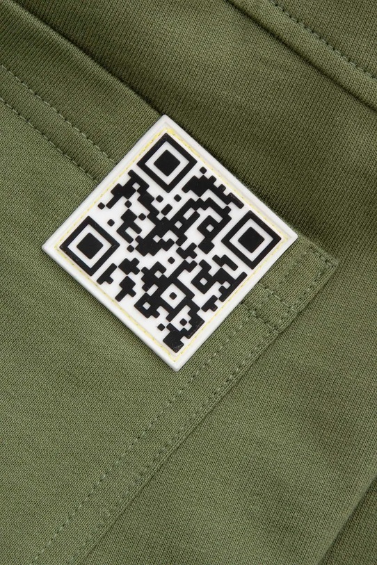 Дитячі бавовняні штани Coccodrillo зелений WC5120104GBJ