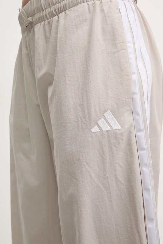 Tepláky adidas Essentials béžová JC8168