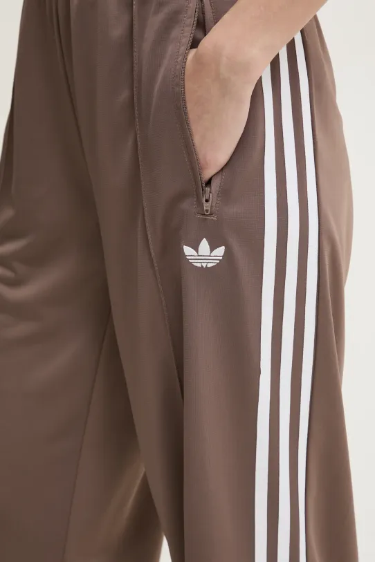 Одяг Спортивні штани adidas Originals Firebird JC8247 коричневий