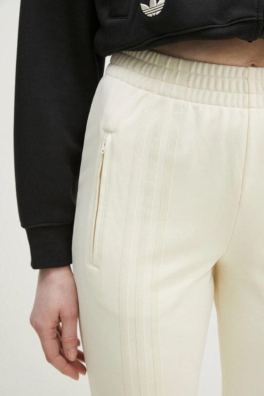 adidas Originals spodnie dresowe Firebird beżowy JJ0936