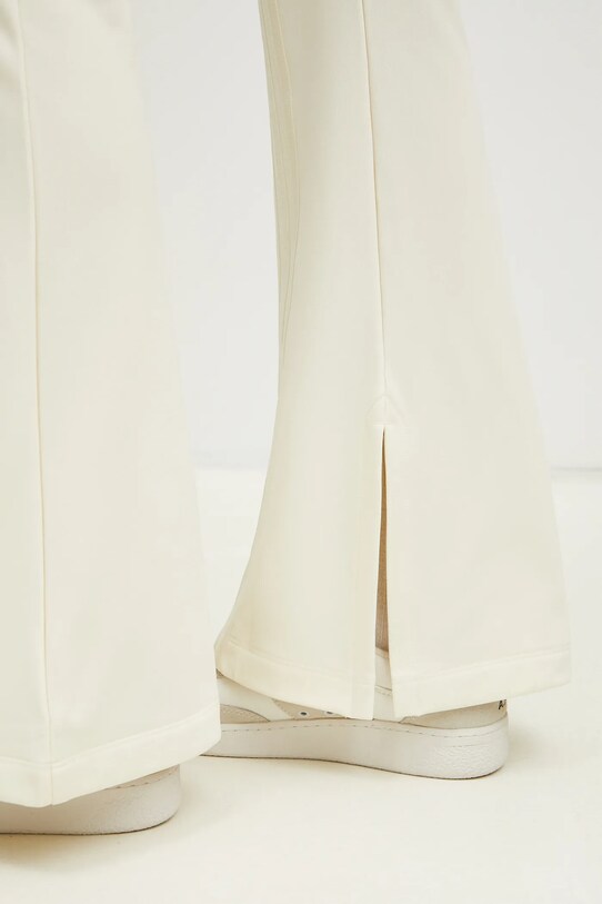 adidas Originals spodnie dresowe Firebird JJ0936 beżowy